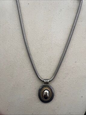 LCI Vintage necklace in silver tone. with round charm,  34”